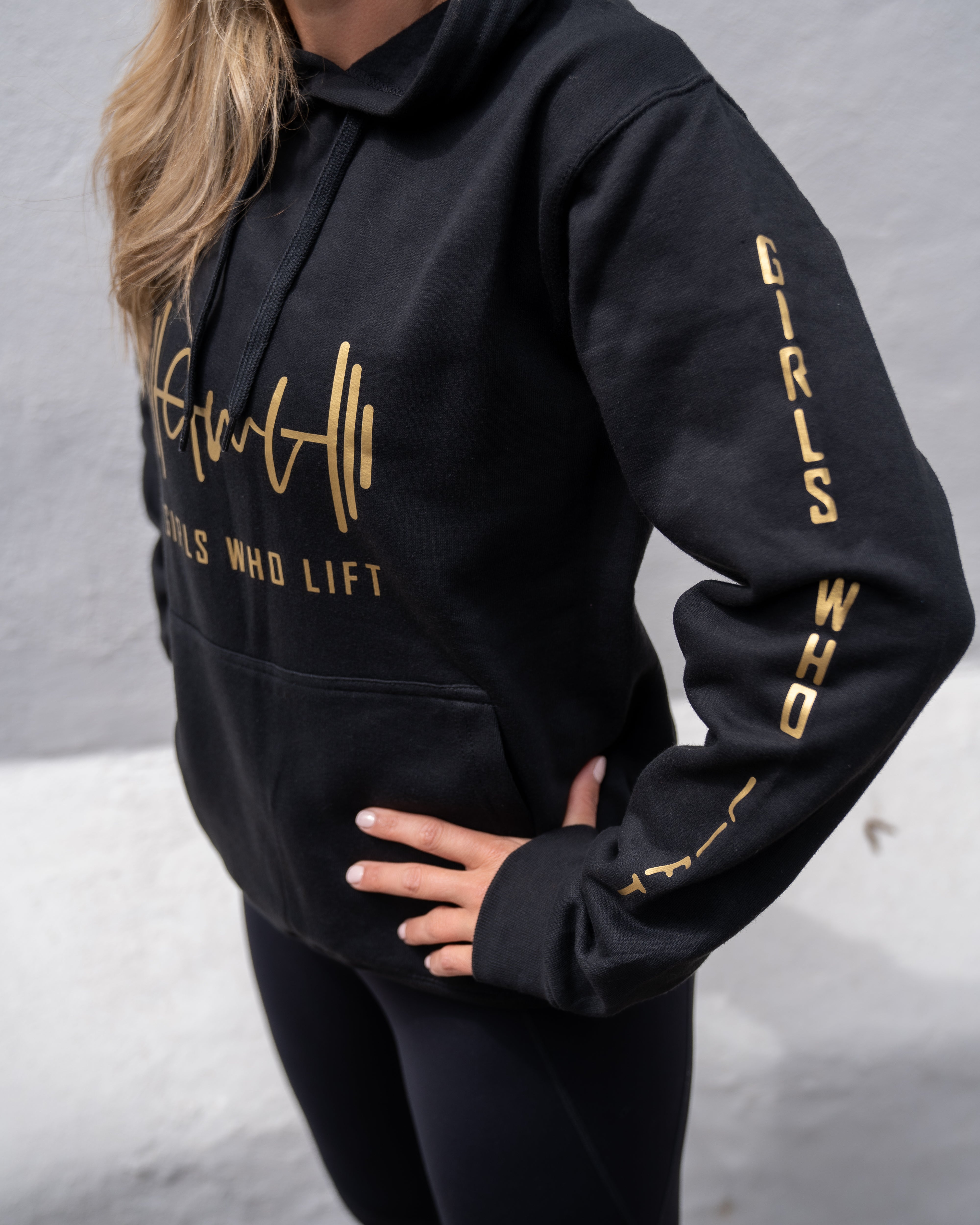 Girls Who Lift hoodie with gold print close up