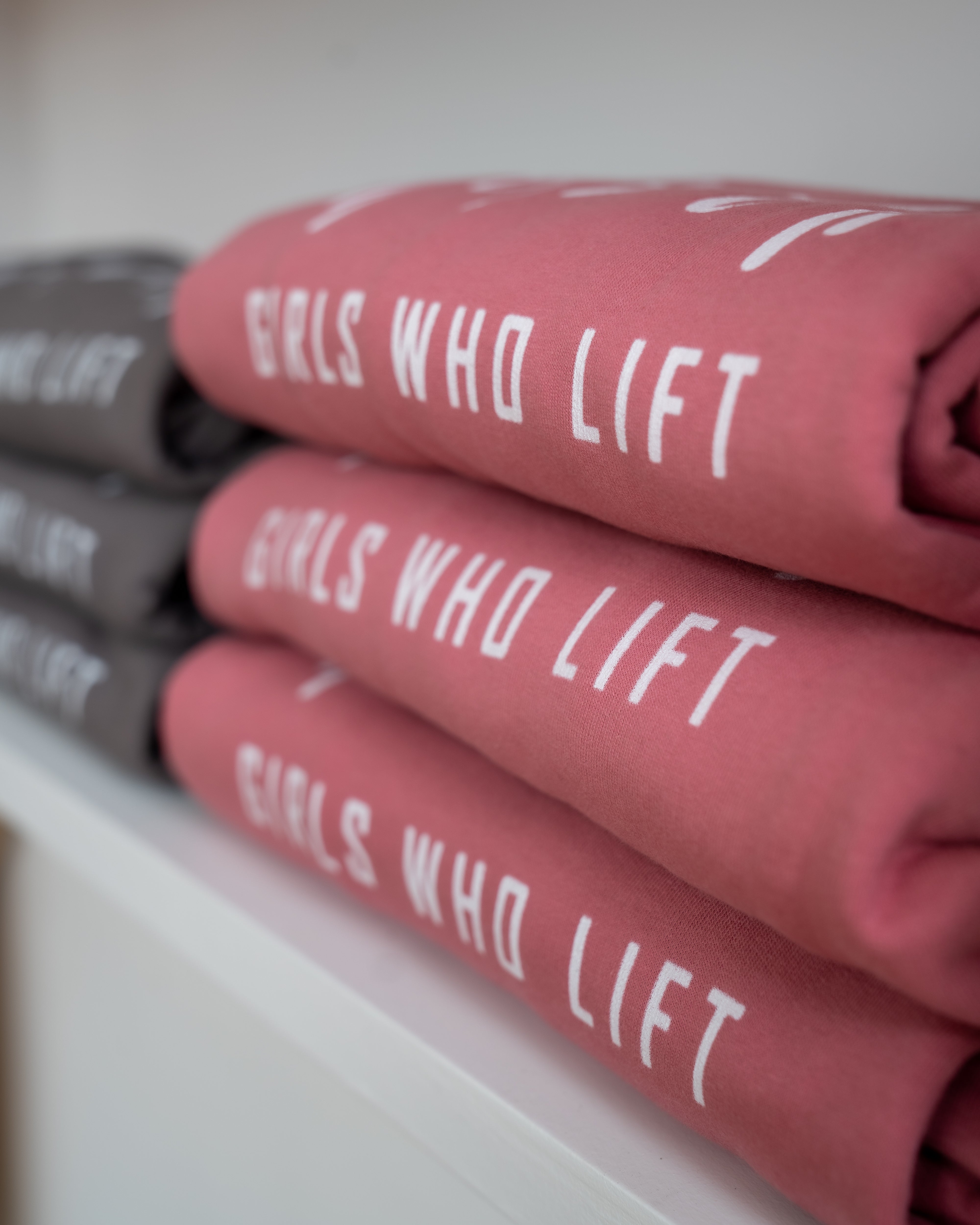 Girls Who Lift sweatshirts close up - dusty rose pink and steel grey